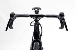 Closeup isolated of a black roadbike in front view 
