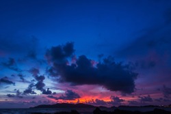 Dark blue sky on Twilight in the Evening over Sea and Silhouette island,Dramatic Sunset on Nightfall,Amazing Dusk sky with sunlight nightfall,Majestic Nature Background.