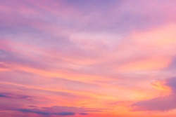 Pink sky,Dusk clouds in the evening,idyllic purple peaceful nature sunlight orange sunset landscape background.