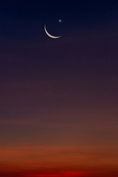 Crescent moon and star on dusk sky in the evening on twilight religion of Islamic begin Ramadan month and free space for text Eid Al Adha, Eid Al Fitr, Muharram