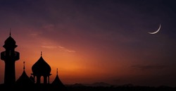 Islamic, Silhouette mosques on dusk sky twilight with crescent moon over mountain, religion of Islam and free space for text Ramadan Kareem, Eid Al Fitr, Eid Al Adha, Eid Mubarak, Muharram, Maulid
