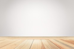 Empty gray wall room interior free space background with blurry soft light and brown wood flat floor perspectives,well can be used for montage or display your products and use text on background.