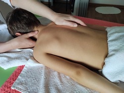 osteopath does physiological and emotional therapy for kid. pediatric osteopathy treatment session. alternative medicine. taking care of the child's health.