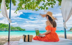 Traveler Asian woman relaxing at sea beach using laptop, Businesswoman on vacation at private resort, Attraction place tourist travel Phuket Thailand summer holiday, Tourism beautiful destination Asia