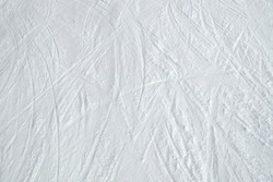 Top view of ski tracks on snow background.