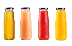 different bottles of juice on white background