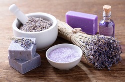 lavender's spa products with dried lavender flowers on a wooden table