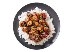 Plate of teriyaki chicken with rice isolated on white background, top view