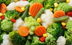 steamed vegetables as background, top view
