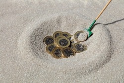 Pound Coins Buried In The Sand.