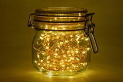 A string of lights with 100 light-emitting diodes lights up in a mason jar.