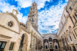 Marble ancient roman architecture in city center of town Split, view at square Peristil in front of cathedral Saint Domnius and  bell tower landmarks, Croatia. / Selective focus.