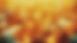 Yellow orange noisy blurred gradient abstract background
