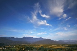 Panoramic view of Mountain Beidawu, the highest mountain in southern Taiwan. The sky is blue with clouds.