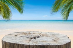 Wooden desk or stump on sand beach in summer. background. For product display,Clipping Path.