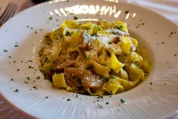 Italian food, firsh course dish, fresh homemade pasta tagliatelle with porcini mushrooms, Parma, Emilia Romagna, Italy, close up