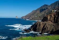 Panoramic view on black lava rocks of Playa del Roque de las Bodegas and blue Atlantic ocean, Anaga national park near Tanagana village,  North of Tenerife, Canary islands, Spain in winter