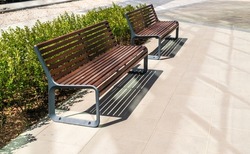 New modern bench in park. Outdoor city architecture, wooden benches, outdoor chair, urban public furniture, empty plank seat, comfortable bench in recreation area