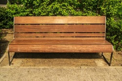 Old, wooden bench in park. Outdoor city architecture, wooden benches, outdoor chair, urban public furniture, empty plank seat, comfortable bench in recreation area