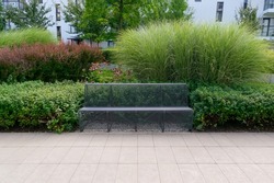 Modern metal bench in park. Outdoor benches, city architecture, outdoor chair, urban public furniture, empty plank seat, comfortable bench in recreation area