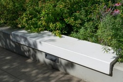 Modern concrete bench in park. Outdoor cement benches, city architecture, outdoor chair, urban public furniture, empty plank seat, comfortable bench in recreation area