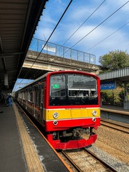 Tangerang Selatan, Indonesia on 25 April 2023: Jakarta Commuter Train Arrive at Jurangmangu Train Station in the Morning