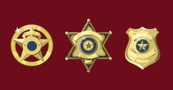 Golden police and sheriff badges on dark red background