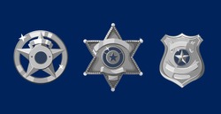 Silver police and sheriff badges on dark blue background