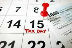 Calendar showing date April 15 2020 with 1040 form, tax day in USA concept