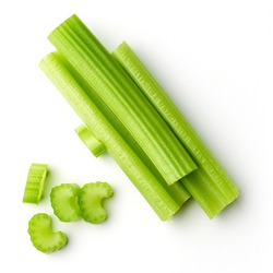 Heap of celery sticks isolated on white background, top view