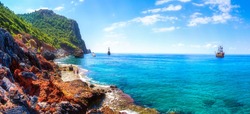 Beautiful seascape in Alanya, Turkey. Sunny summer day in turkey resort. Amazing view on rocky coastline and blue mediterranean sea with ships.