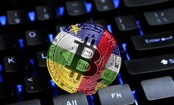 Bitcoin close-up on keyboard background, the flag of Central African republic is shown on bitcoin.