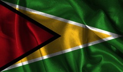 Realistic flag of Guyana on the wavy surface of fabric. This flag can be used in design.