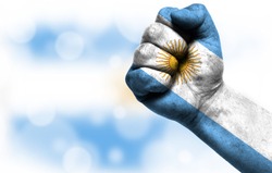 Flag of Argentina painted on male fist
