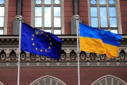 Flags of Ukraine and European Union in Kiev. Yellow-blue state Ukrainian and European Union flags in Kyiv, near  National Bank, Independence Constitution Day, National holiday.