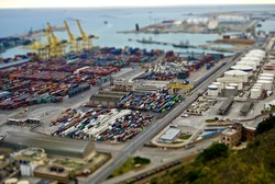 Barcelona harbor with cargo and factories. Tilt Shift Effect