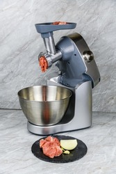 Making ground meat in modern food processor with meat grinder