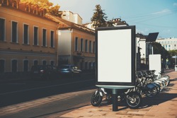Square information board with road and crosswalk around, empty rectangular banner mock-up with bicycle parking behind, blank billboard with copy space place for advertising message or your logo