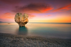Lonely rock sculpture at the shape of heart, Preveli, Crete, Greece