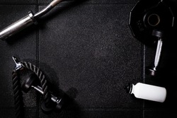 Gym equipment on dark background in cross Gym for fit people
