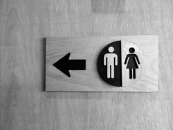 Toilets icon, Public restroom signs ,Toilet sign and direction on wooden background