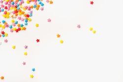 sprinkles, sprinkles in the form of stars, colored background, sprinkles for Easter cake 