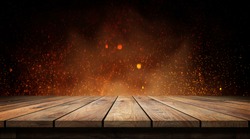 Old wood table with flame effect on dark background. 