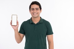 Attractive cheerful young man showing mobile phone.