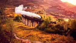 Historical Steam Train is crossing the Glenfiann Viaduct