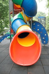 Children's playground colorful large group of seesaws and slides                              