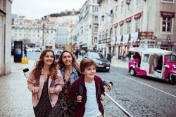 Young Caucasian family traveling and exploring the capital city of Portugal Lisbon
