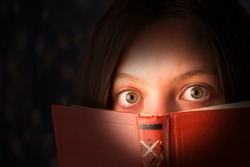 scared girl with a book, reading horrors