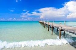 A white sand beach with blue sky and clear water sea landscape at Ao Phrao beach on Koh Kood island in Gulf of Thailand