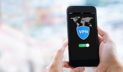 VPN Internet protocols private network concept.Man hands holding mobile phone